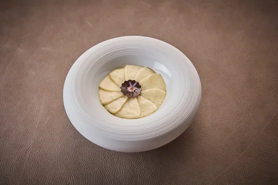 Plate with dish, Skrei cod – King oyster mushroom – Bergamot – Juniper – Périgord truffle