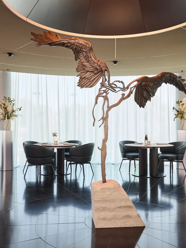 inside area of Restaurant Ikarus with Ikarus sculpture