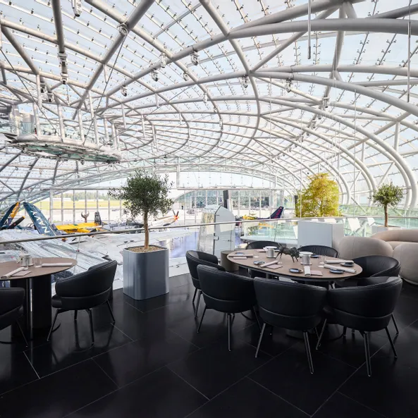 Set table at Restaurant Ikarus terrace with view of the exhibition 