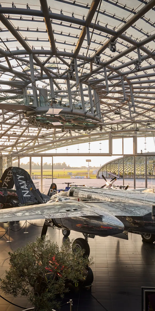 Interior view of Hangar-7 showing its glass-and-steel architecture and exhibits in the exhibition