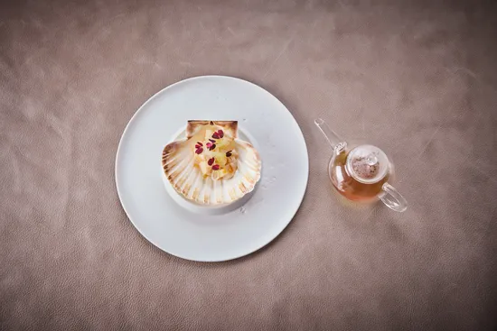 Dish of July Guest Chef Rafa Costa e Silva, Scallop – Chayote – Finger lime – Shellfish consommé