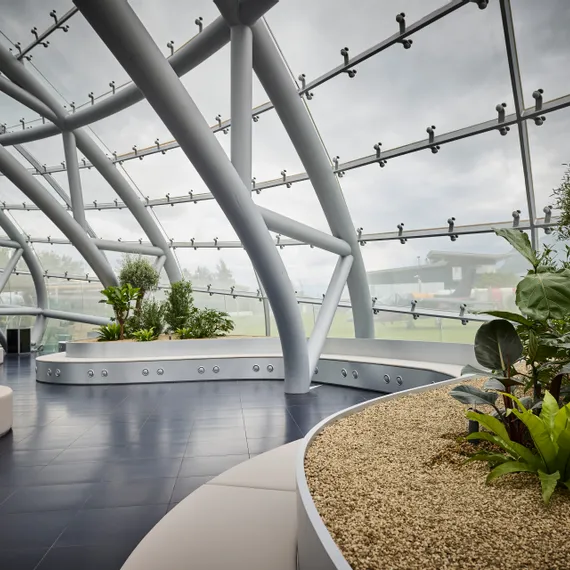 Architecture of Hangar-7 with plants and seating 